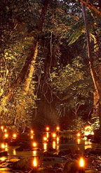 CANDLES & SPOTLIGHTS SURROUND THE RIVER