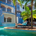 Featuring a 3 storey cascading fountain and a resort style pool with island - Regal Port Douglas